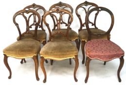 A set of five Victorian mahogany balloon back dining chairs.