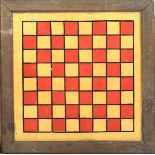 An Edwardian hand painted glass chess board. Set in a rectangular oak frame, 37.5cm x 37.