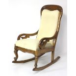 A 19th century Continental fruitwood rocking chair.