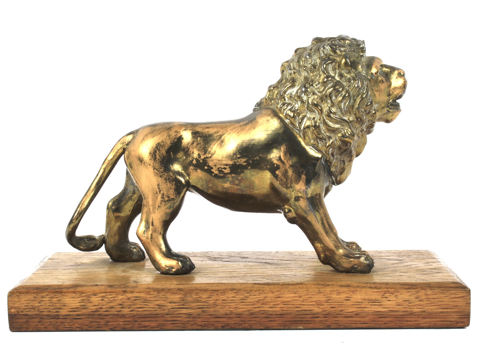 An early 20th century brass model of a lion on wooden stand mounted as a paperweight.