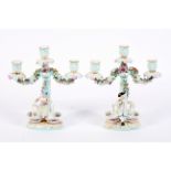 A pair of Continental porcelain late 19th century Meissen-style three-light candelabra.