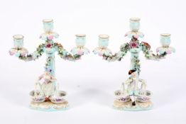 A pair of Continental porcelain late 19th century Meissen-style three-light candelabra.