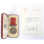 An Elizabeth II British Empire medal, with case and certificate.