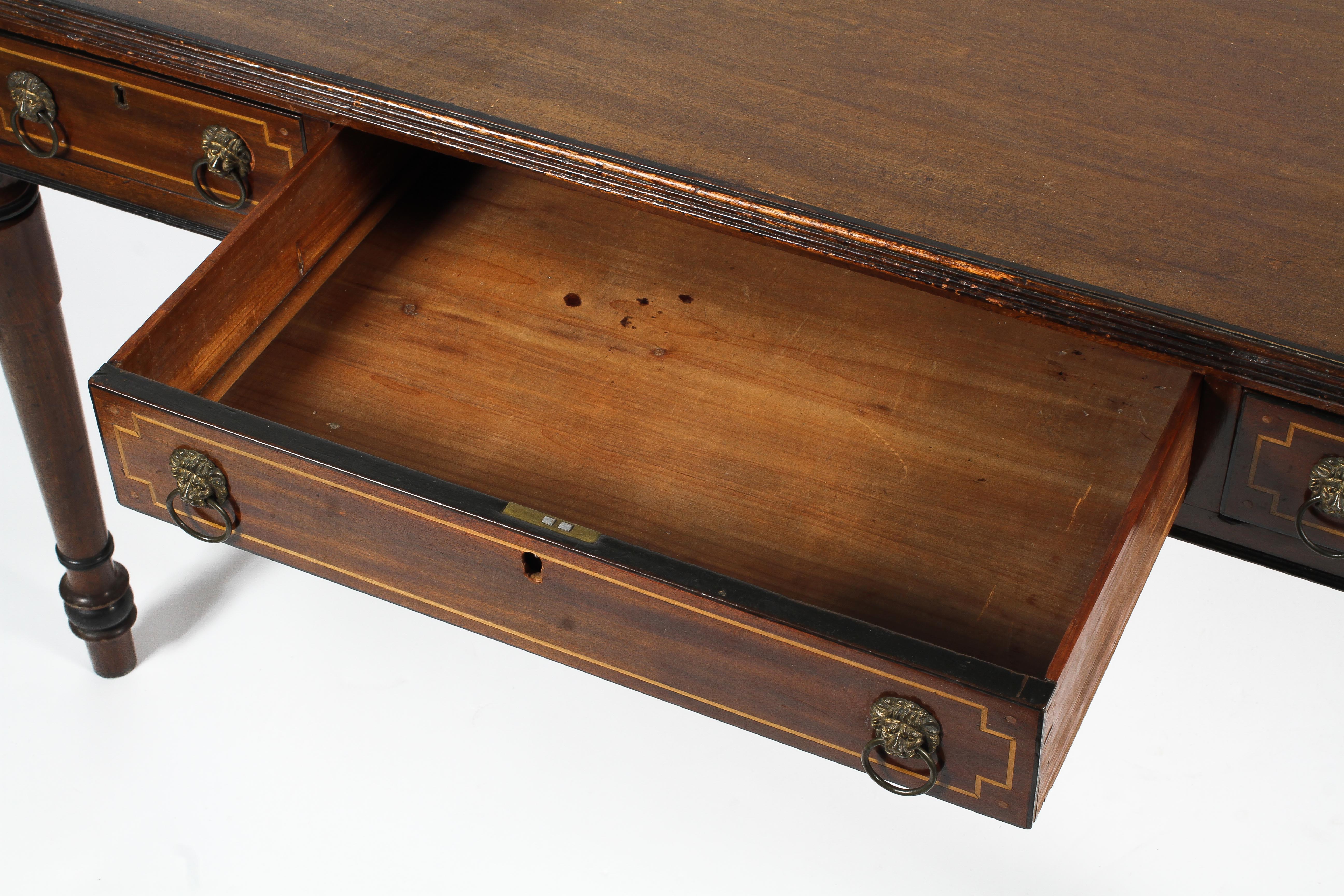 A Regency style mahogany writing table. - Image 3 of 3