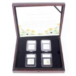 The Beatrix Potter UK four stamps and four 50ps coin set.