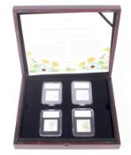 The Beatrix Potter UK four stamps and four 50ps coin set.