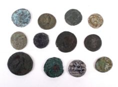 Twelve Roman coins, including one of silver.