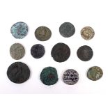 Twelve Roman coins, including one of silver.