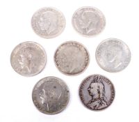 Seven half crown coins.