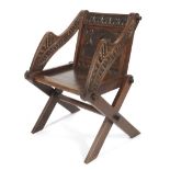 An oak Glastonbury elbow chair.
