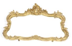 A 19th century giltwood and gesso scroll shaped overmantel mirror.