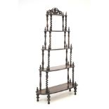 A Victorian rosewood whatnot five tiered stand.