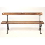 A 19th century iron and pitch pine tram swing back pew/ bench.