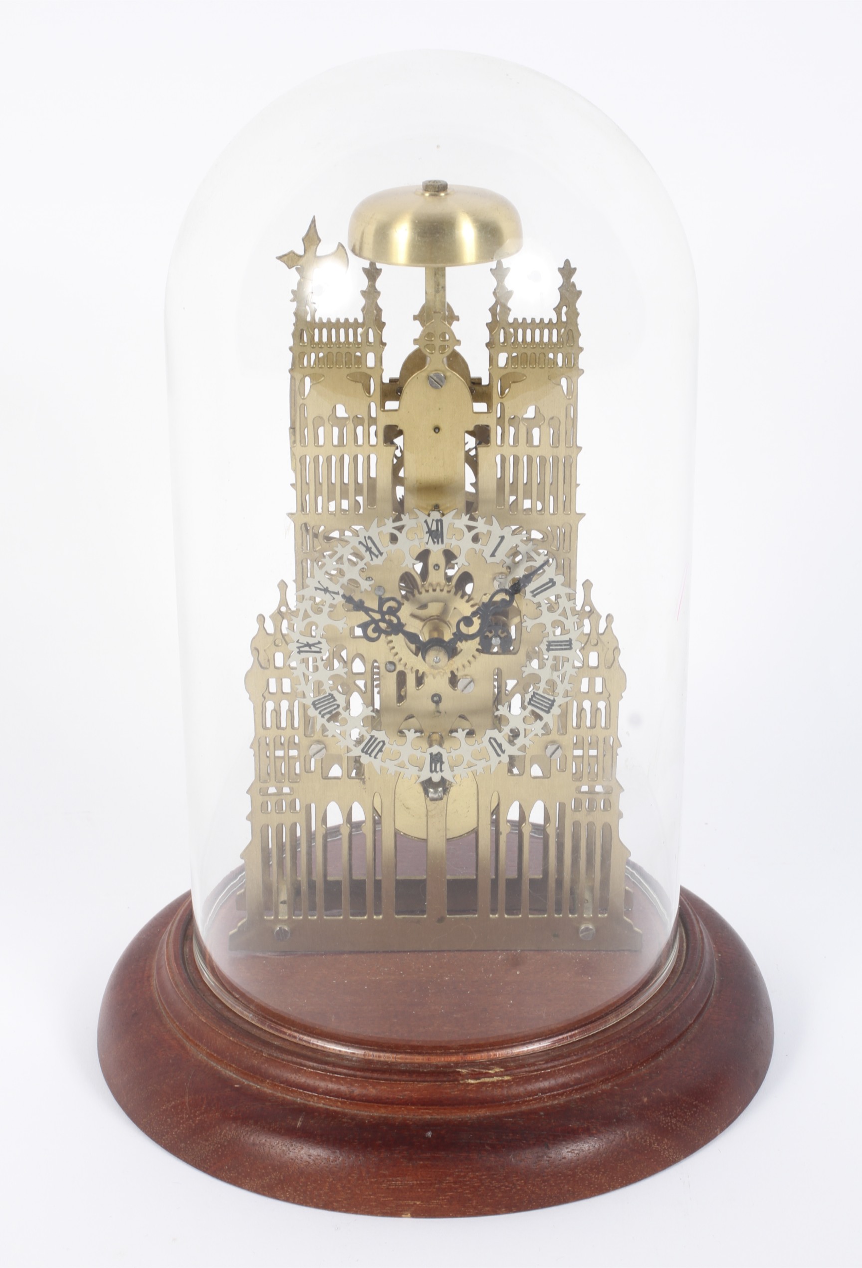 A modern dome-covered Westminster skeleton brass clock.