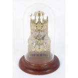 A modern dome-covered Westminster skeleton brass clock.