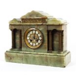 A late 19th/early 20th century French onyx eight-day mantel clock.