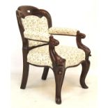 A Victorian mahogany framed button back armchair.