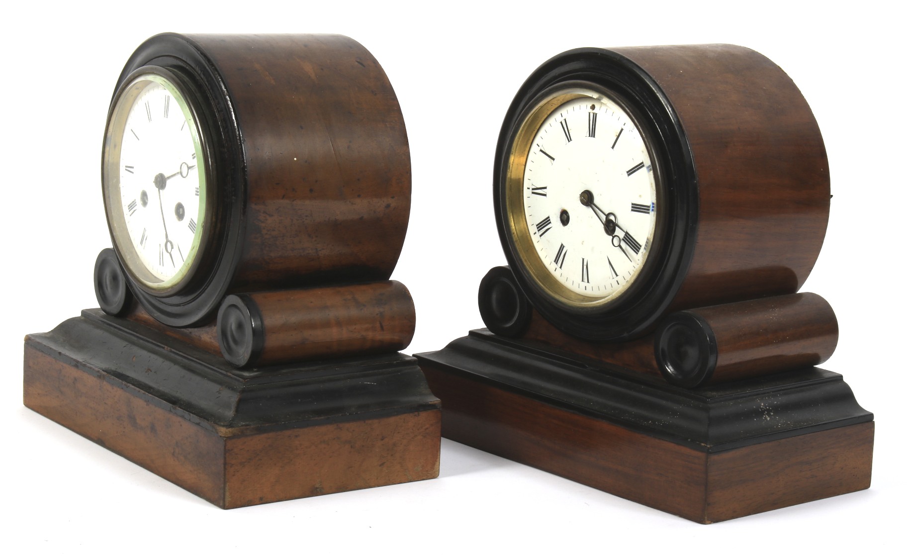 A pair of similar mahogany and ebony Art Deco mantel clocks.