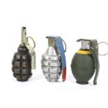 A collection of three inert hand grenades