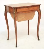 A late 19th century French crossbanded satinwood and gilt-metal mounted sewing table.