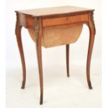 A late 19th century French crossbanded satinwood and gilt-metal mounted sewing table.