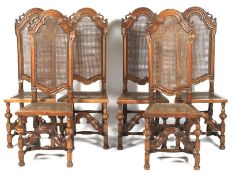 Set of six carolean cane back walnut chairs. With carved arched top rail and cane backs and seats.