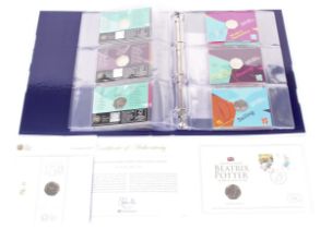 Album of 29 Olympic 50p coins, London 2012, and a 2107 Peter Rabbit coin cover.