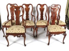 A 20th century elm wake drop leaf table and chairs.