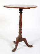 An early 20th century mahogany pedestal wine table.