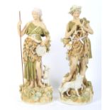 A pair of early 20th century Royal Dux figures of a shepherd and companion.