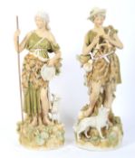 A pair of early 20th century Royal Dux figures of a shepherd and companion.