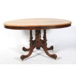 A Victorian walnut loo table.