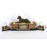 A French Art Deco alabaster and marble three piece clock garniture.