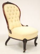 A Victorian mahogany framed balloon-shaped button back chair.