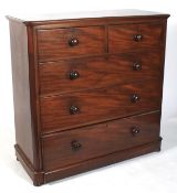 A Victorian mahogany chest of two short over three long graduating drawers.