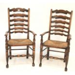A pair of provincial rush seated ladder back armchairs.