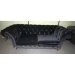 A large Clive Christian Chesterfield sofa.