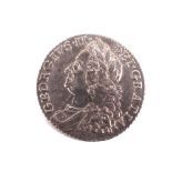 A 1758 shilling coin.