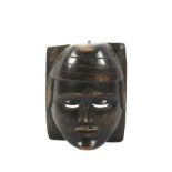 A 20th century large carved wooden tribal wall mask.