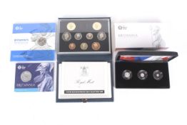 Two coin sets and two presentation coins.