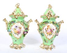 A pair of 19th century Coalport green-ground baluster pot-pourri vases and domed covers.