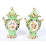 A pair of 19th century Coalport green-ground baluster pot-pourri vases and domed covers.