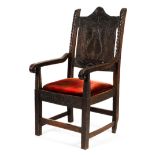 An early 19th century wainscot panelled back chair.