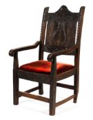 An early 19th century wainscot panelled back chair.
