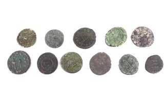 Eleven Roman coins.