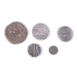 Four Indian coins and a Spanish 1727 1 real coin.