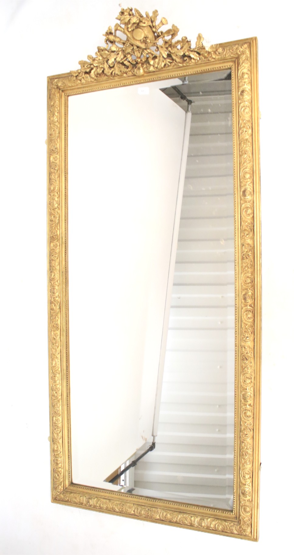 A large giltwood and gesso pier mirror. Late 19th century with some later elements.