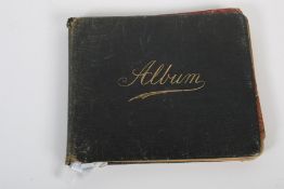 A 1920s leather visitor's album. Inscribed with verse, messages, watercolours, pencil sketches, etc.