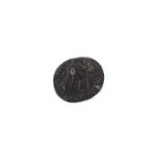 A cast metal Roman coin. With emperor's profile on one side and mythological figure to reverse.