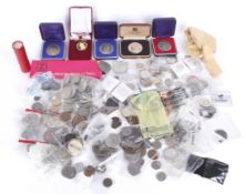 A large quantity of world coins, some of silver and several copies of old coins.